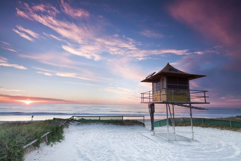 lifeguard hut on australian beach at sunrise 1030x687