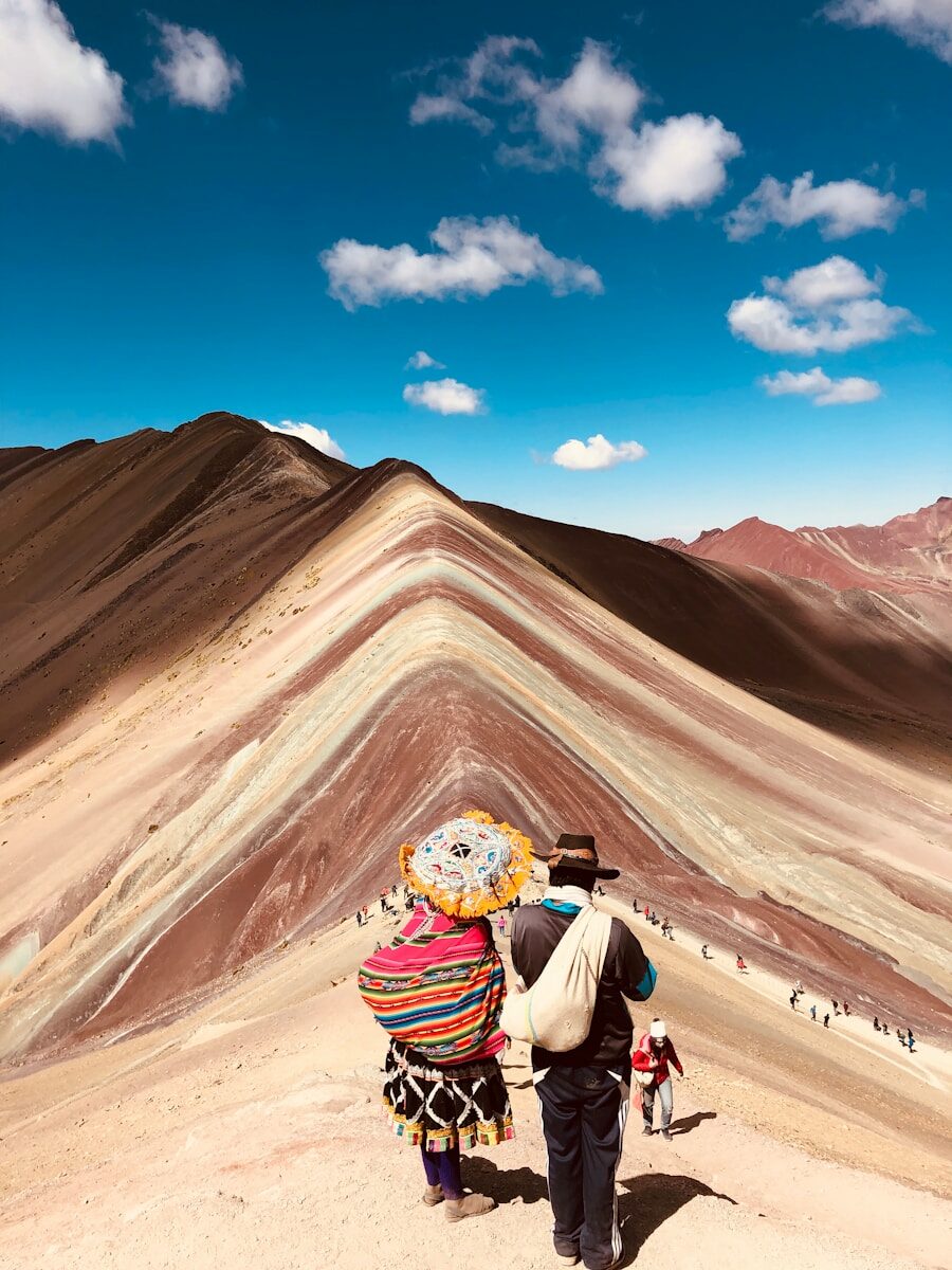 a couple of people that are standing in the dirt